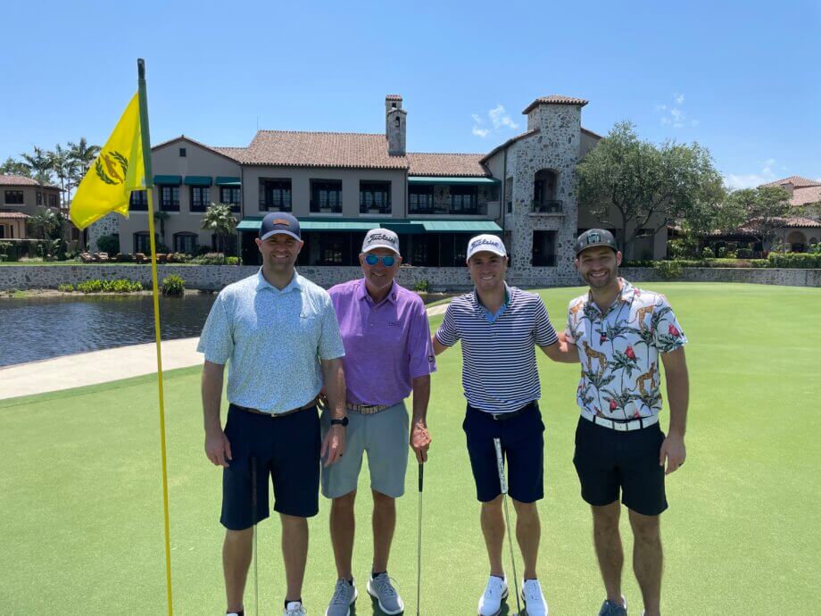 Standing on the 18th green with Mike and Justin Thomas